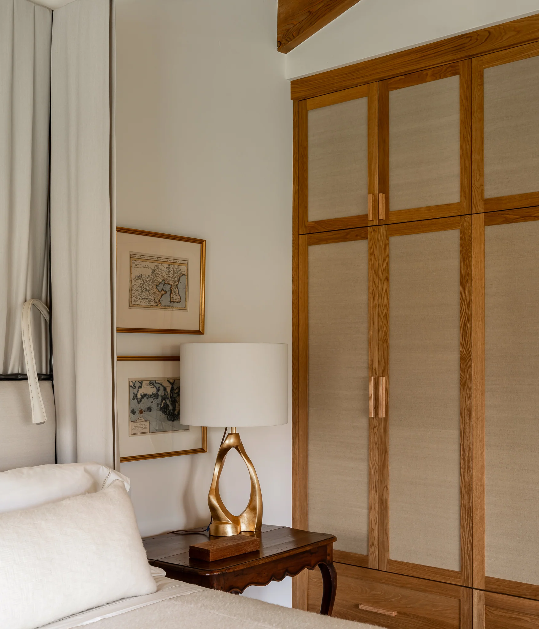 Bedroom corner with grasscloth wardrobe doors and a brass lamp — interior design photography Driggs Idaho, River's Edge